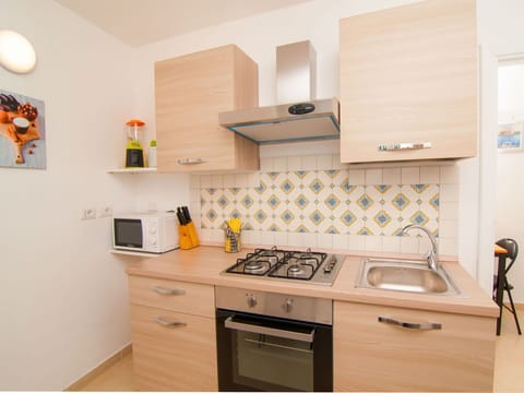 Room, Property, Kitchen, Furniture, Cabinetry, Yellow, Interior Design, Countertop, House, Major Appliance