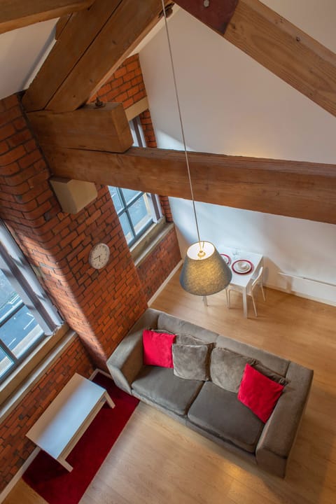 Bedroom looking down on open plan living/dining area