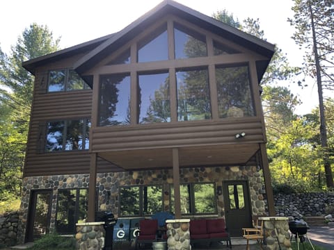 Outdoor seating with new propane grill and corn hole set!