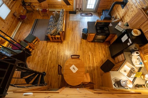 Looking down from loft into kitchen and living room 