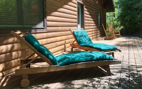 the back deck is surrounded by forest