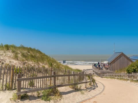 Sky, Plant, Cloud, Azure, Fence, Land Lot, Road Surface, Coastal And Oceanic Landforms, Tree, House