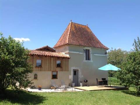 A cute little building with private sun deck and garden