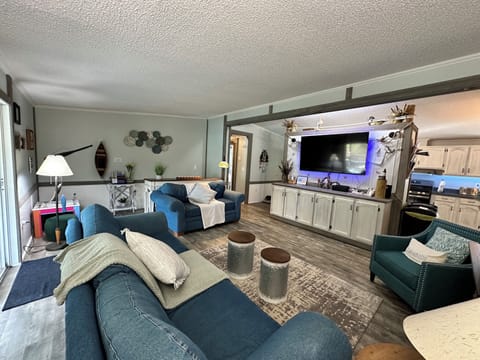 Spacious family room, with 65" smart TV with a wide variety of viewing options