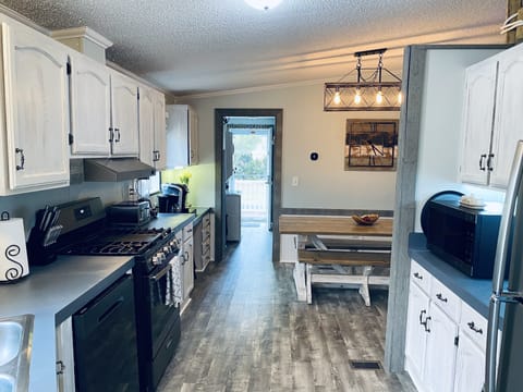 Black stainless appliances, including dishwasher and central AC