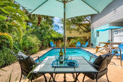 Outdoor pool seating makes this home a private oasis.
