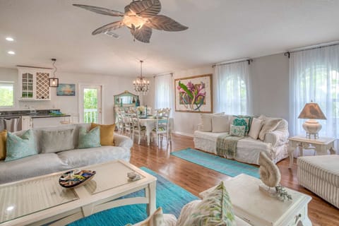 Freshly decorated open living room with plenty of seating.