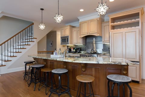 Well stocked kitchen with bar seating.