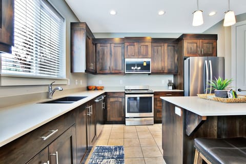 Clean and well equipped Kitchen with Island Top