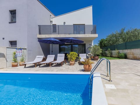 Water, Plant, Property, Building, Swimming Pool, Azure, Sky, Blue, Shade, Outdoor Furniture