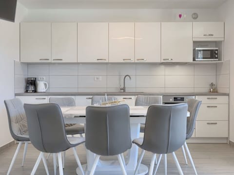 White, Furniture, Room, Property, Interior Design, Kitchen, Countertop, Table, Floor, Chair