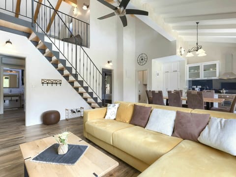 Table, Couch, Picture Frame, Property, Furniture, Wood, Ceiling Fan, Lighting, Studio Couch, Interior Design