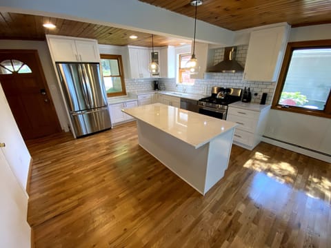Brand new kitchen with quartz countertops and new appliances.