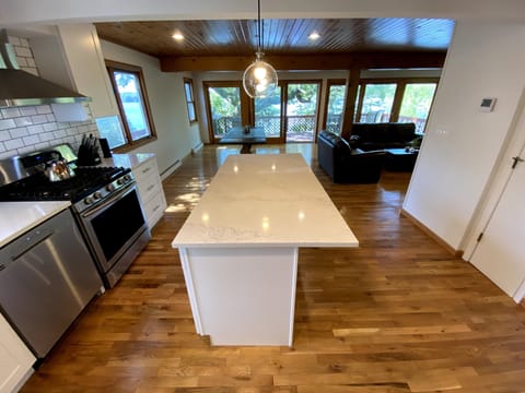 Brand new kitchen with quartz countertops and new appliances.