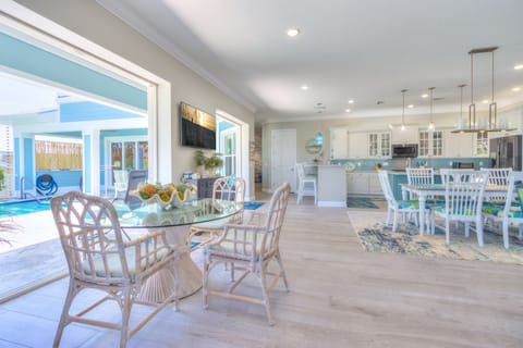 • Indoor dining table by the kitchen (long rectangular table), seats up to 8 guests

• Dining table by the pool (round table), seats up to 3 guests