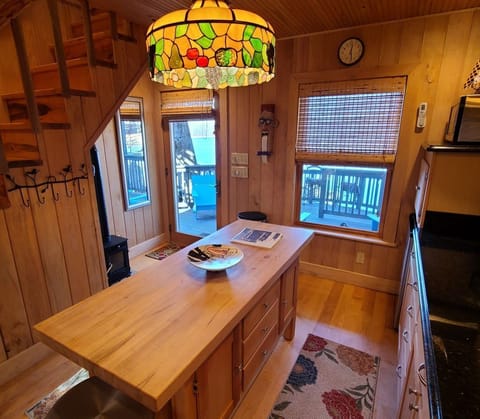 Another view of the kitchen and front entrance to the cabin.