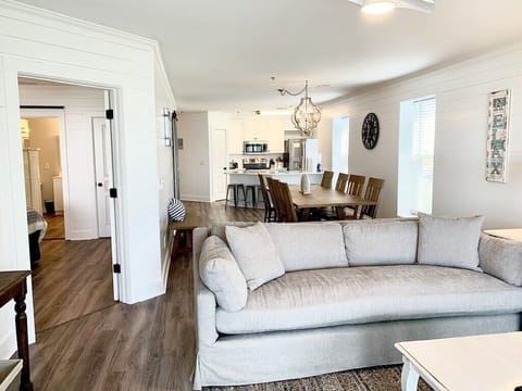 Open-concept living and dining area 208 1140 Ocean Blvd, Isle of Palms, SC | IOP Escapes