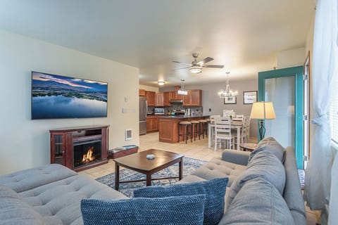 Open floor plan living, dining, kitchen opens up to the back grassy area.