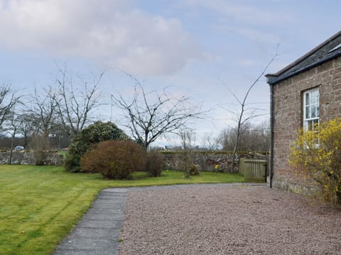 Gravelled and lawned areas surrounding the cottages