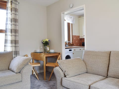 Living room with dining area | Sea Breeze Cottage, Buckie