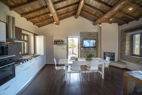 Spacious kitchen/ dining room leads to comfortable balcony & BBQ area