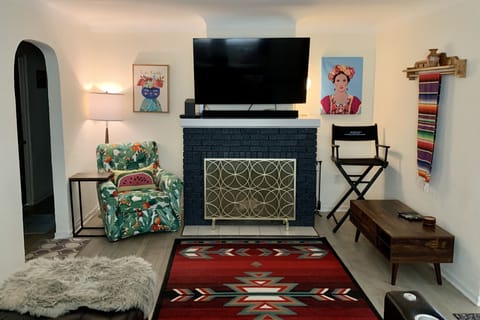 Living room with 4k 55" TV, surround sound, DVD player, DVR & full cable package