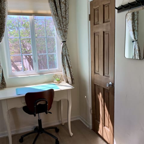 Desk in back bedroom overlooks the back yard