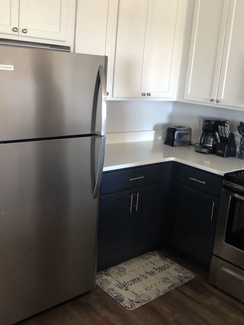 Full kitchen with refrigerator/toaster/Stove/oven/Dishwashwer/Microwave 