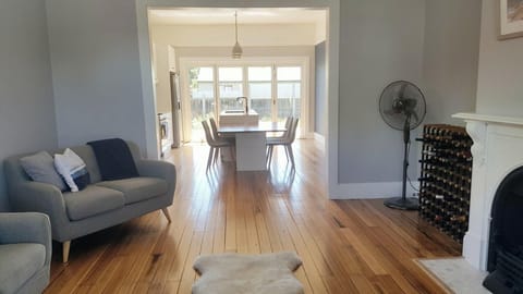 Hardwood flooring enhances the charm of this bright, open layout.