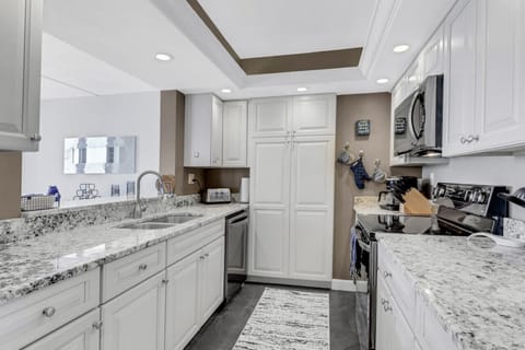 Kitchen with pantry and broom closet.