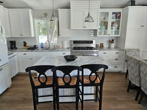 Kitchen seats 6 at table and 3 at the island.