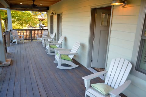 Back porch at the bungalows with ceiling fans to relax. 