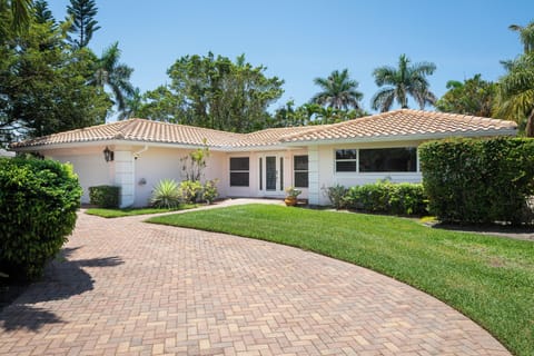 Our Newly Painted Exterior Set in Beautiful Tropical Grounds