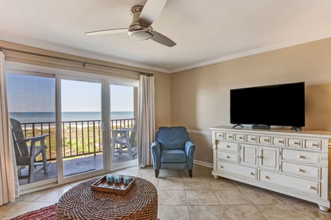 Watch TV or the Waves from Your Third Floor Unit