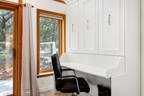 Private workspace during the day. Queen size murphy bed at night.