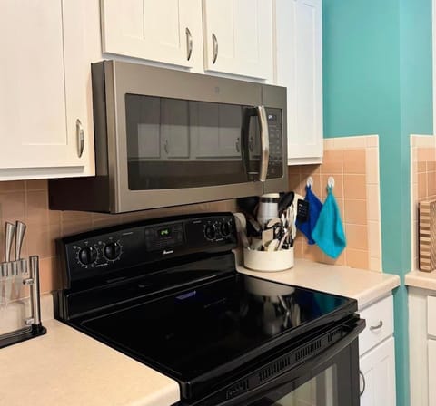 Fully stocked kitchen with electric stove