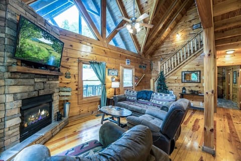 Exposed beams and large picture windows really define the elegance of your cabin