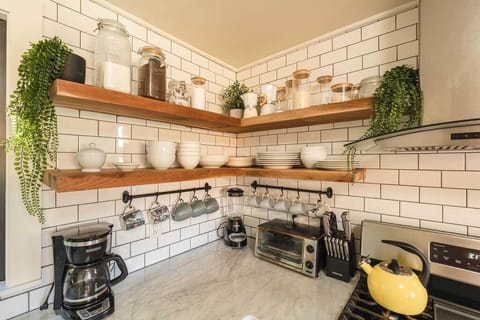 Our walnut floating shelves. Photo @ethanabitz