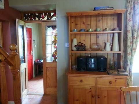Dining area. View through double doors to front hall.