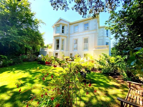 Garden. Muntham Apartment 5 - overlooks The Rose Garden at the side of the property.