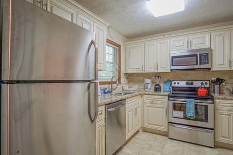 New stainless steel appliances in full kitchen
