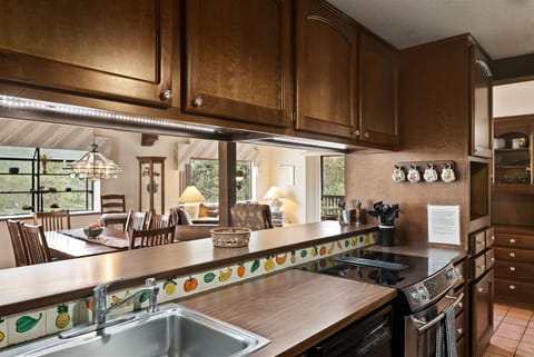 The kitchen opens to the dining area