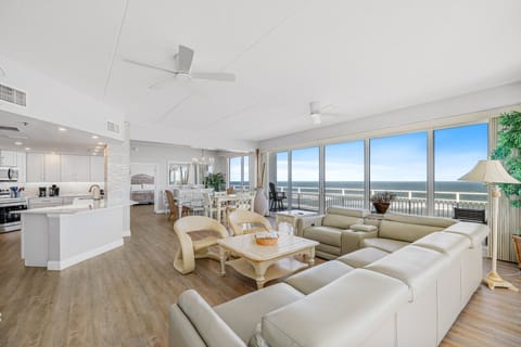 Open flow between the living area, dining area, and kitchen.