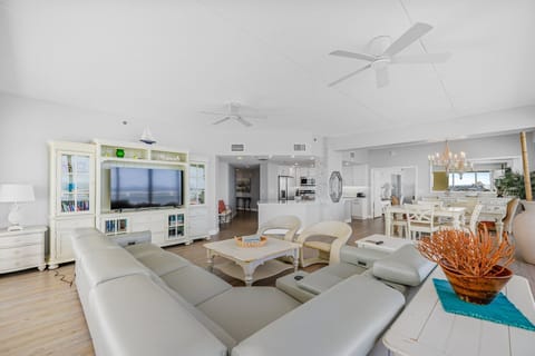Open flow between the living area, dining area, and kitchen.