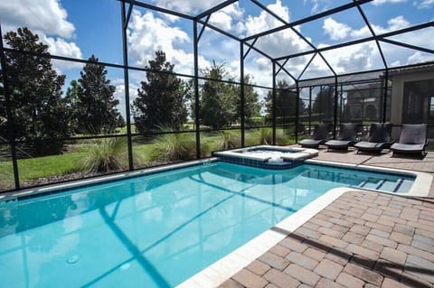 Private pool with jacuzzi spa and lounge chairs.