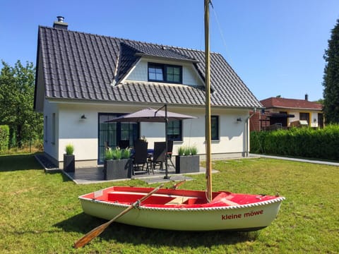 Sky, Plant, Property, Window, Building, Vehicle, Tree, House, Boat, Shade