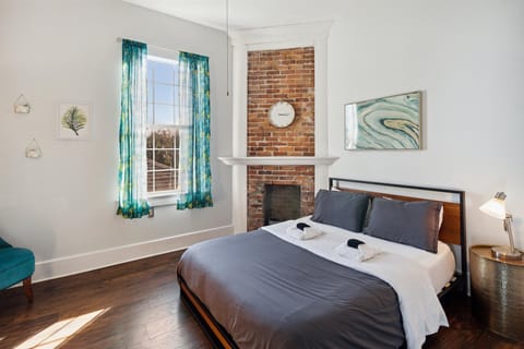 Green room is a private bedroom with queen bed and Roku smart TV.