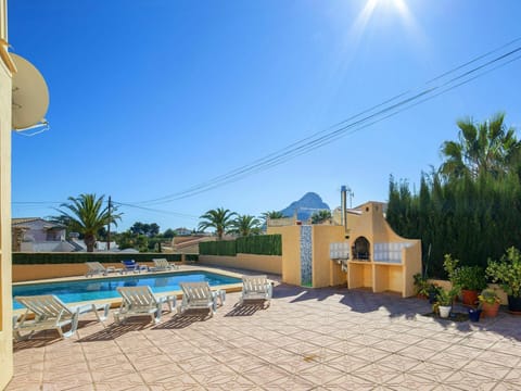 Sky, Plant, Building, Azure, Tree, Shade, House, Arecales, Outdoor Furniture, Flowerpot