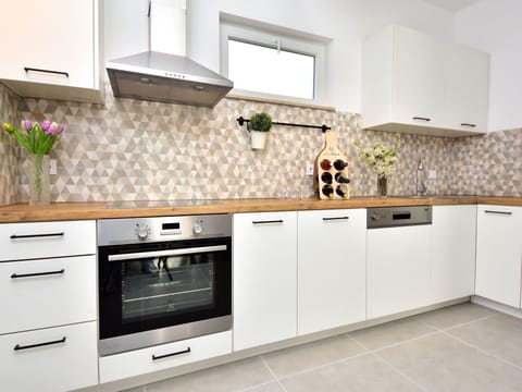 Countertop, Kitchen, Room, Cabinetry, White, Furniture, Property, Tile, Interior Design, Floor