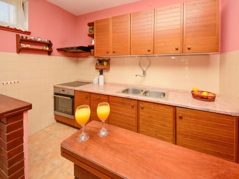 Room, Kitchen, Furniture, Property, Countertop, Cabinetry, Orange, Building, Yellow, Interior Design